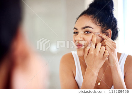 Skincare, mirror and woman popping acne on face with hands, dirt or scar on skin in home. Dermatology, facial wellness and girl in bathroom to squeeze pimple, checking reflection or morning routine Skincare, mirror and woman popping acne on face with hands, dirt or scar on skin in home. Dermatology, facial wellness and girl in bathroom to squeeze pimple, checking reflection or morning routine 115289466