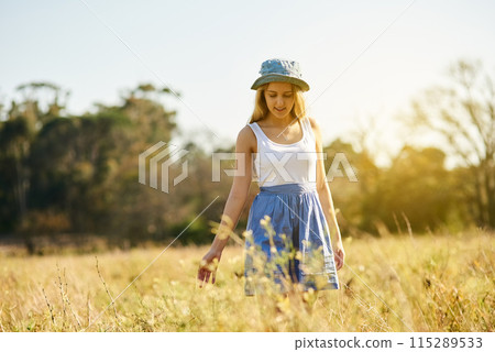 Gen z, girl and walking in nature for freedom, travel and adventure in countryside for spring. Young woman, smile and sunshine in park or garden with flowers, leaves and outdoor journey in France Gen z, girl and walking in nature for freedom, travel and adventure in countryside for spring. Young woman, smile and sunshine in park or garden with flowers, leaves and outdoor journey in France 115289533