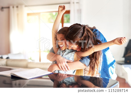 Learning, hug or mother and daughter with homework in kitchen celebration, success and bonding at home. Education, books and excited mom embrace proud girl in house with school, project and support 115289714