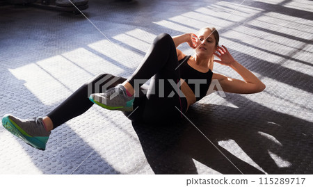 Fitness, crunches and woman in gym with workout for health, wellness and body training activity. Cardio, strength and young female athlete with core exercise for ab routine in sports center. Fitness, crunches and woman in gym with workout for health, wellness and body training activity. Cardio, strength and young female athlete with core exercise for ab routine in sports center. 115289717