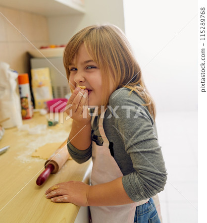 Happy, young girl and learning to cook in portrait with dough and rolling pin for lesson in kitchen. Excited, food and chef baking cookies at home for child development and cooking education Happy, young girl and learning to cook in portrait with dough and rolling pin for lesson in kitchen. Excited, food and chef baking cookies at home for child development and cooking education 115289768