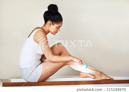 Happy woman, shave and grooming legs with razor blade for epilation, hygiene or hair removal in bathroom at home. Female person or model with cream or lotion in depilation treatment for skincare 115289970