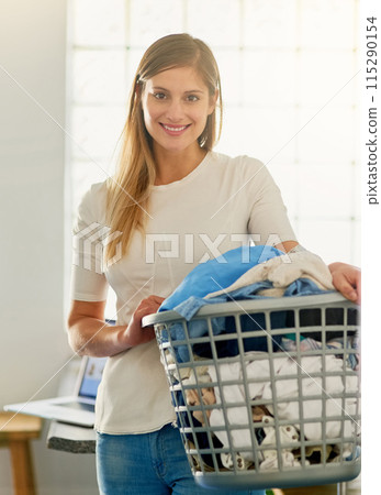 Cleaning, portrait and woman with a laundry basket for chores, housekeeping and hygiene at home. Face, female person or cleaner with dirty clothes, apartment and washing fabric with smile in house 115290154