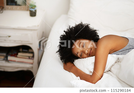 Black woman, sleeping or peace in bed for morning, rest and feeling calm in home for recovery. Female person, relax or comfortable in bedroom for tired, exhausted or fatigue and dreaming on weekend Black woman, sleeping or peace in bed for morning, rest and feeling calm in home for recovery. Female person, relax or comfortable in bedroom for tired, exhausted or fatigue and dreaming on weekend 115290184