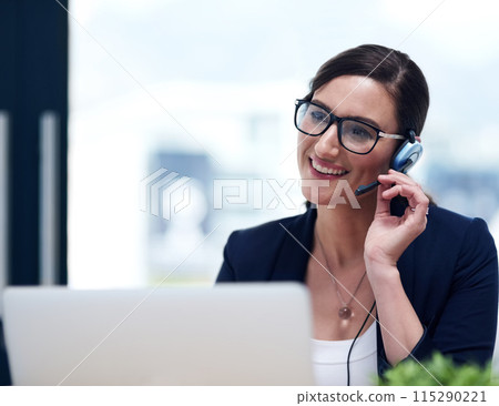 Businesswoman, smile and headset at laptop for telemarketing sales, call centre or communication. Female person, contact us and help desk or technical support in office, customer service or advice 115290221