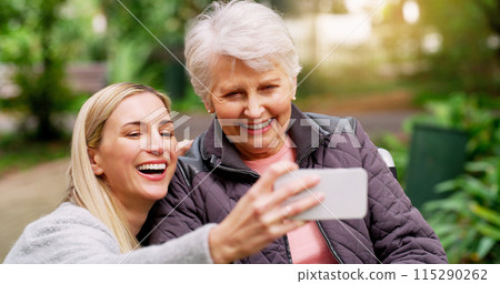 Wheelchair, senior woman and selfie at park for retirement, bonding or rehabilitation. Person with disability, mother and daughter happy together in nature for healthcare, support and mobility aid Wheelchair, senior woman and selfie at park for retirement, bonding or rehabilitation. Person with disability, mother and daughter happy together in nature for healthcare, support and mobility aid 115290262