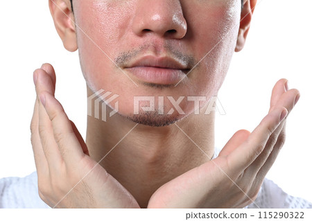 Man touching his face examining complexion after laser skin resurfacing isolated over white background Man touching his face examining complexion after laser skin resurfacing isolated over white background 115290322