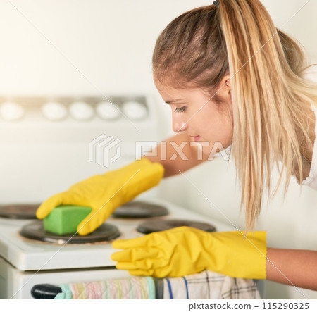 Woman, kitchen and cleaning stove in home for hygiene, housework or housekeeping service for safety. Chores, cooker and maid with sponge to scrub dirt, dust and bacteria on electrical appliance oven Woman, kitchen and cleaning stove in home for hygiene, housework or housekeeping service for safety. Chores, cooker and maid with sponge to scrub dirt, dust and bacteria on electrical appliance oven 115290325