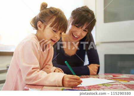 Happy mother, daughter and drawing with paper for coloring activity, bonding or homework. Mom and little girl, child or young kid with smile for imagination, creativity or childhood together at house Happy mother, daughter and drawing with paper for coloring activity, bonding or homework. Mom and little girl, child or young kid with smile for imagination, creativity or childhood together at house 115290380