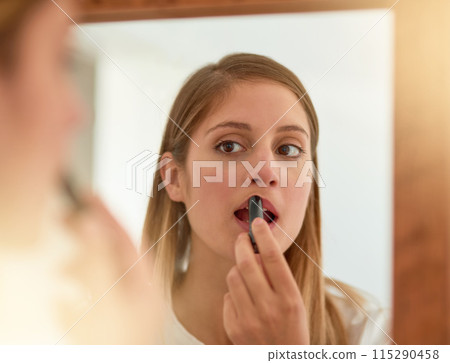 Woman, home and mirror with lipstick for beauty, reflection and confident with results. Female person, face and lips for appearance, aesthetics and cosmetics for transformation with self care 115290458