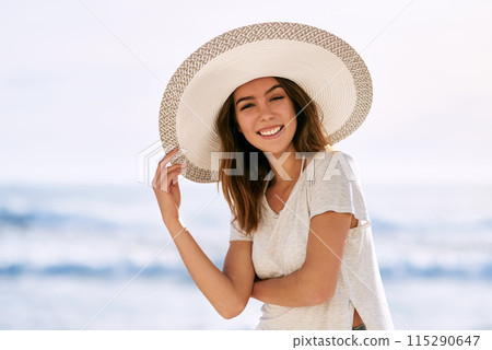 Portrait, smile and woman with sun hat at beach for summer travel, vacation and tourism in Miami. Outdoor, happy and relax by ocean with peace for adventure, weekend trip and confidence on holiday Portrait, smile and woman with sun hat at beach for summer travel, vacation and tourism in Miami. Outdoor, happy and relax by ocean with peace for adventure, weekend trip and confidence on holiday 115290647