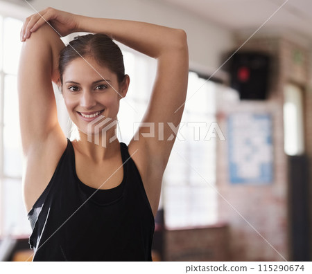 Happy, woman and fitness with stretch in gym for health, wellness and flexibility exercise. Sports, female person and athlete with muscle warm up and smile for cardio training, strength workout and 115290674