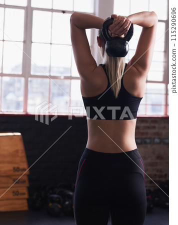 Woman, back and gym and lifting kettlebell, strength and health goals for wellness or exercise training with athlete. Body builder, workout club and sports target, goal for muscle development Woman, back and gym and lifting kettlebell, strength and health goals for wellness or exercise training with athlete. Body builder, workout club and sports target, goal for muscle development 115290696