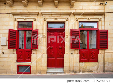 Traditional Maltese house, with colorful doors and windows. Zabbar Malta 115290977