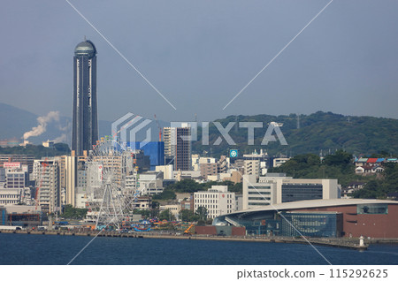 Shimonoseki City Aquarium Kaikyokan and Kaikyo Yume Tower on the Shimonoseki side of the Kanmon Straits as seen from Mekari SA in the morning 115292625