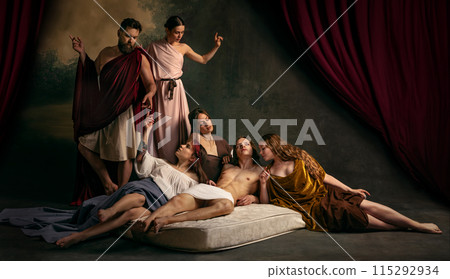 Family moment where father and mother watch their son, lying on matrass, who surrounded by three young, beautiful girls. 115292934