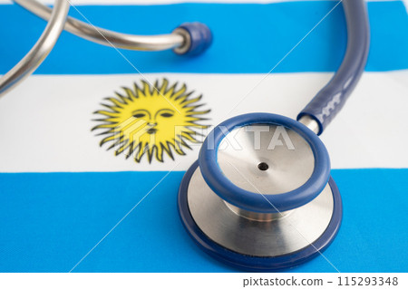 Stethoscope on Argentina flag background, Business and finance. Stethoscope on Argentina flag background, Business and finance. 115293348