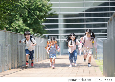 Elementary school student running with backpack on Elementary school student running with backpack on 115293553