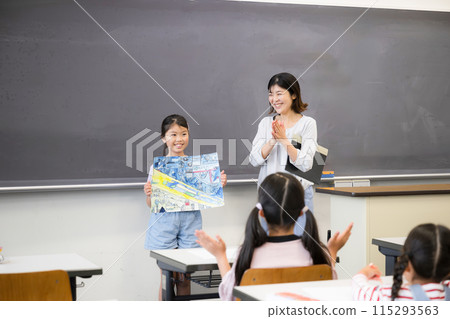 Children and teachers presenting their drawings and crafts at school. Well done! Children and teachers presenting their drawings and crafts at school. Well done! 115293563