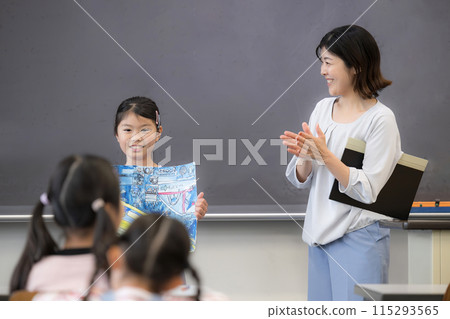 Children and teachers presenting their drawings and crafts at school. Well done! Children and teachers presenting their drawings and crafts at school. Well done! 115293565