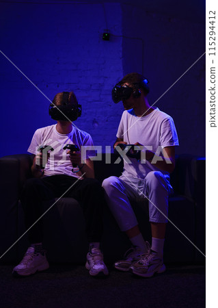 The player plays the game using virtual reality. Neon style. 115294412