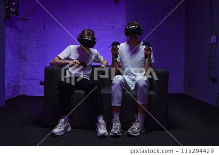 The player plays the game using virtual reality. Neon style. 115294429