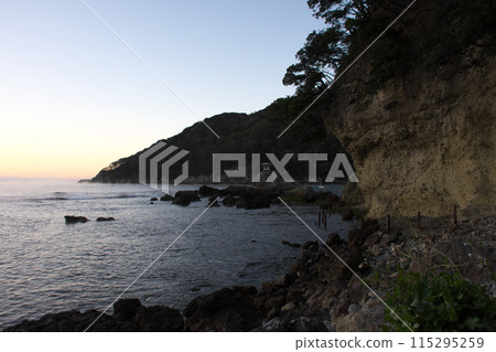 View of the sea at sunrise from the promenade View of the sea at sunrise from the promenade 115295259