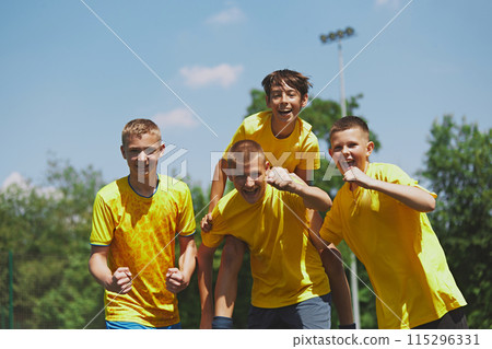 Celebrating Team Success. Young soccer players celebrate well-played game, capturing essence of teamwork and shared happiness in youth sports. 115296331