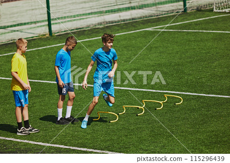 Dynamic Sports Exercise. Young soccer athletes perform agility exercises, demonstrating skills, speed and endurance. 115296439