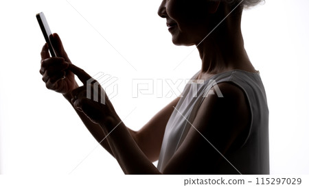 Senior woman silhouette smartphone 115297029