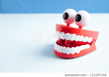 Funny red teeth with eye toy denture model for dental health care. Funny red teeth with eye toy denture model for dental health care. 115297148