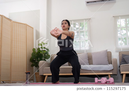 Inspirational Journey of a Woman Losing Weight Through Home Exercise and Healthy Lifestyle in a Modern Living Room Setting Inspirational Journey of a Woman Losing Weight Through Home Exercise and Healthy Lifestyle in a Modern Living Room Setting 115297175