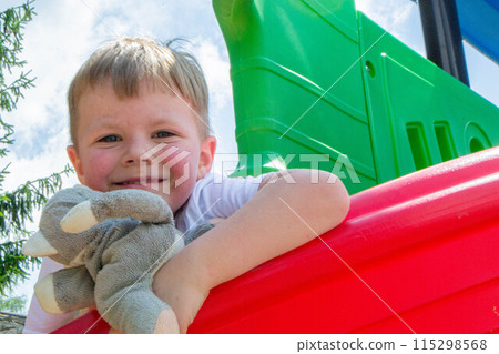 Kids having fun in ferris wheel with chains, carousel ski flyer in amusement park in Targoviste, Romania, 2020. High quality photo 115298568