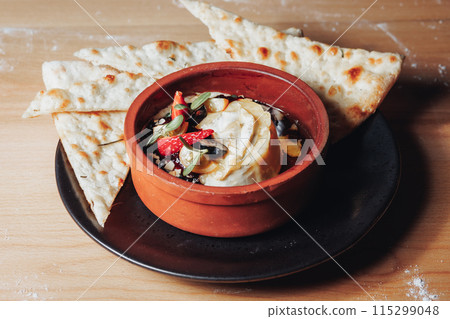 Savory Serenity: Pita and Dip Delight Savory Serenity: Pita and Dip Delight 115299048