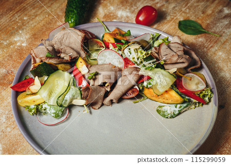 Savoring Earths Bounty,A plate filled with a variety of cooked meat and colorful vegetables, 115299059