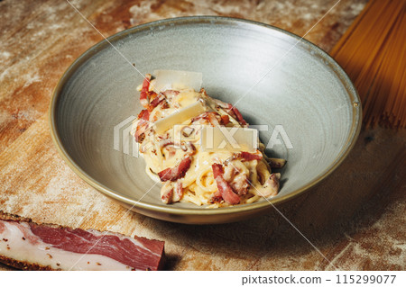 Delectable Pasta Delight With Savory Meat and Crusty Bread Delectable Pasta Delight With Savory Meat and Crusty Bread 115299077