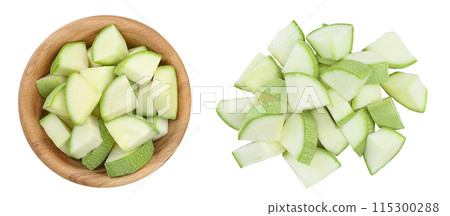diced zucchini or marrow in wooden bowl isolated on white background with full depth of field. Top view. Flat lay diced zucchini or marrow in wooden bowl isolated on white background with full depth of field. Top view. Flat lay 115300288