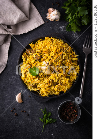 Pilaf, rice with vegetables and lamb meat 115300536
