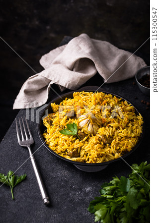 Pilaf, rice with vegetables and lamb meat 115300547