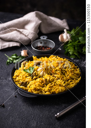 Pilaf, rice with vegetables and lamb meat 115300550