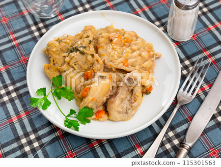 stewed rabbit with white beens stewed rabbit with white beens 115301563