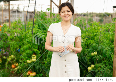 Asian woman at vegetable garden 115301779