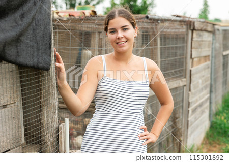 young girl at farm 115301892