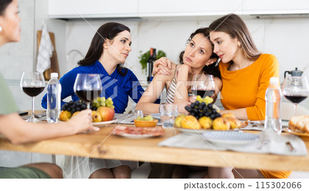 Besties consoling woman after emotional upset at house party Besties consoling woman after emotional upset at house party 115302066