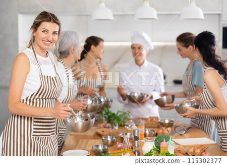Young woman holding bowl in her hands Young woman holding bowl in her hands 115302377