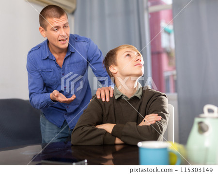Man and his teenage son offended at each other after quarrel 115303149