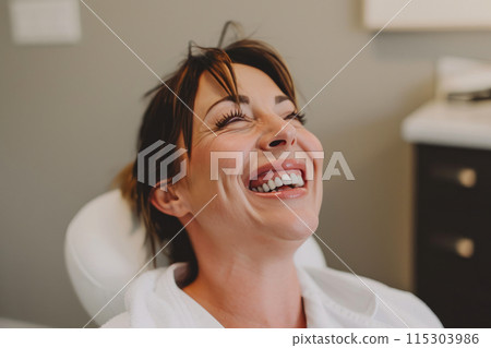 Graceful Renewal: Woman's Joyful Expression in Minimalist Clinic Graceful Renewal: Woman's Joyful Expression in Minimalist Clinic 115303986