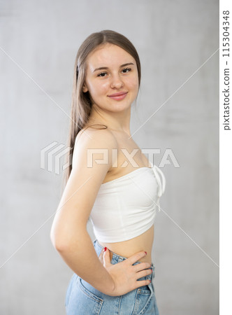 Young smiling woman posing in studio Young smiling woman posing in studio 115304348