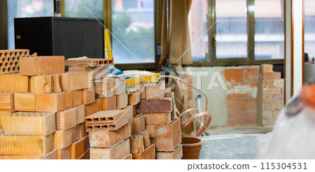 Construction materials inside the building under construction Construction materials inside the building under construction 115304531