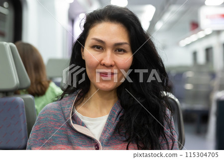 Portrait of woman traveling in urban trai 115304705